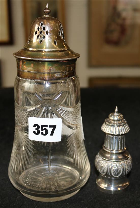 Silver mounted sugar shaker and a silver pepper pot